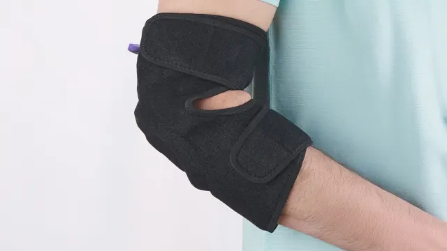 The Heated Vibration Therapy Compression Elbow Wrap