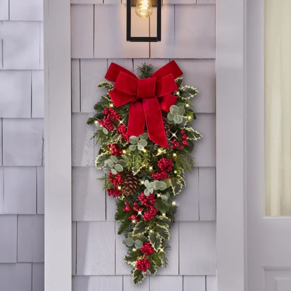 The Cordless Prelit Holly/Berries/Ribbon Holiday Sconce