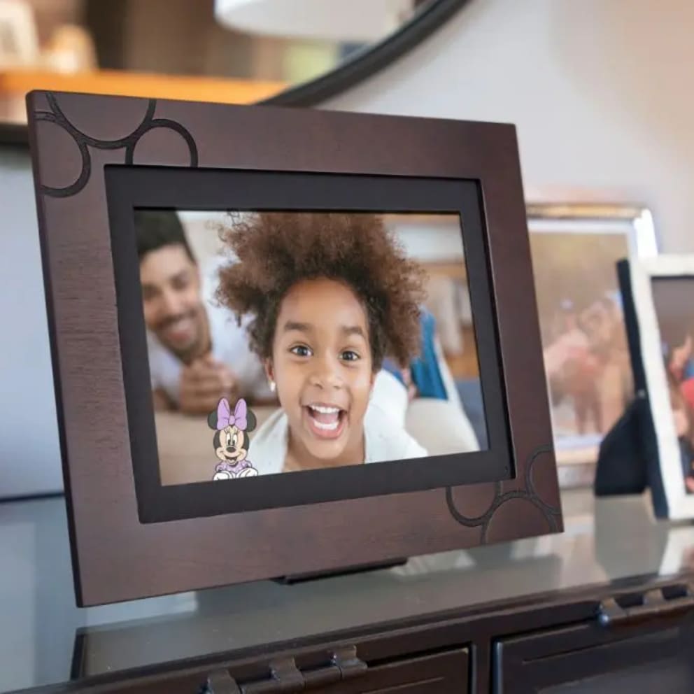 The PhotosShare app lets you edit, add characters, and caption photos