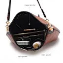 Interior includes one wall zip pocket and two slip pockets