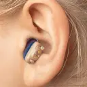 Discreet in-ear hearing aid designed for comfortable, clear everyday listening.