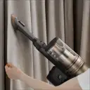Versatile cordless design with 2 attachments to remove dust and pet hair from furniture, curtains, and more