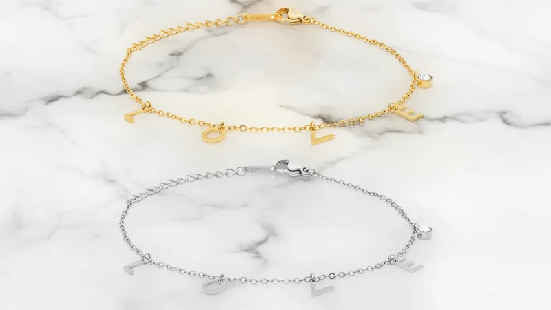 Steeltime Set de 2 Pulseras con Dijes de Diamantes Simulados "L O V E"