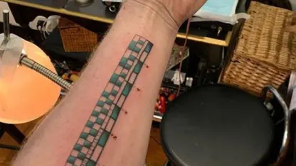 Adam Savage's arm ruler tattoo