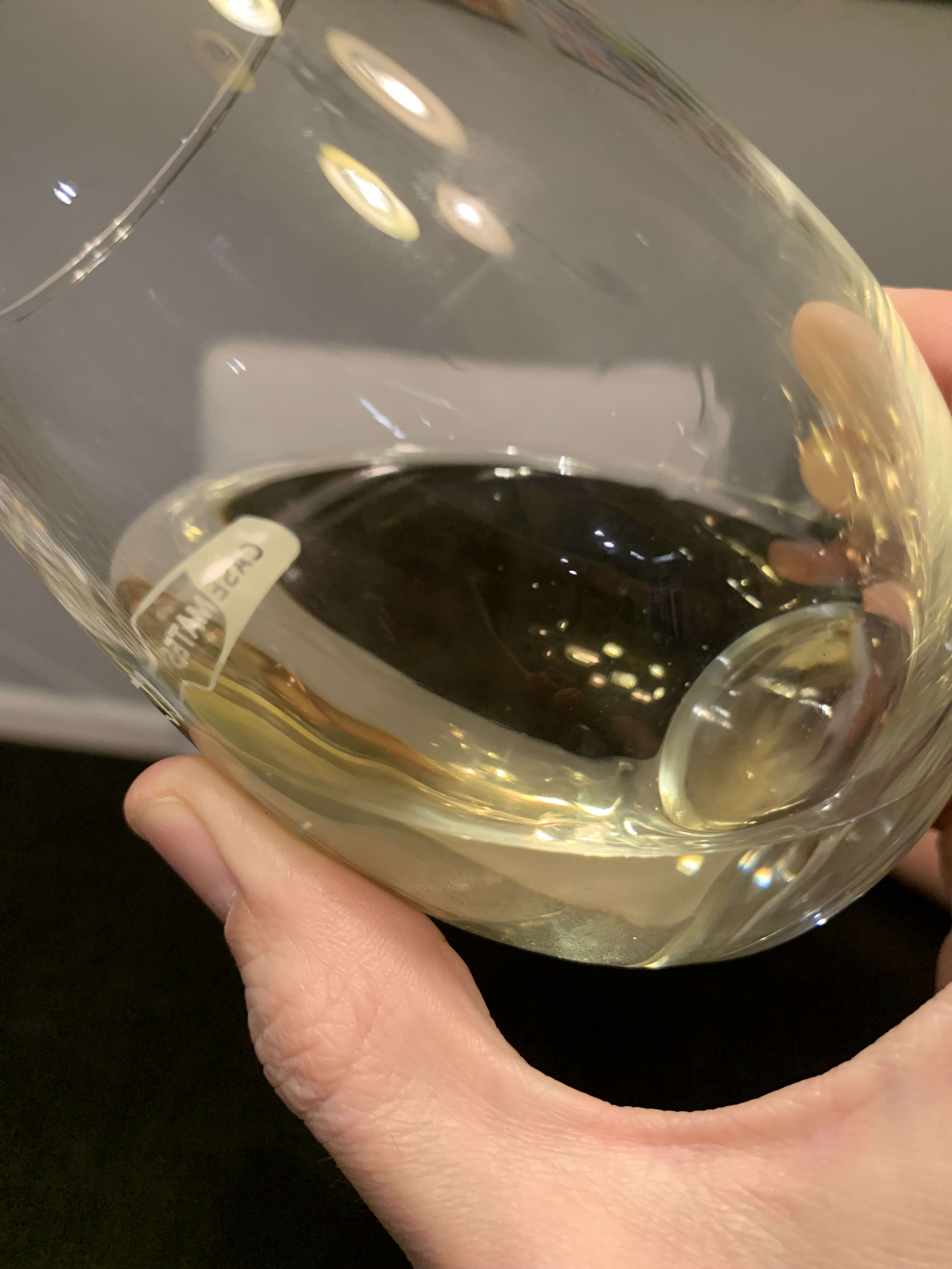 broken earth wine in glass tilted