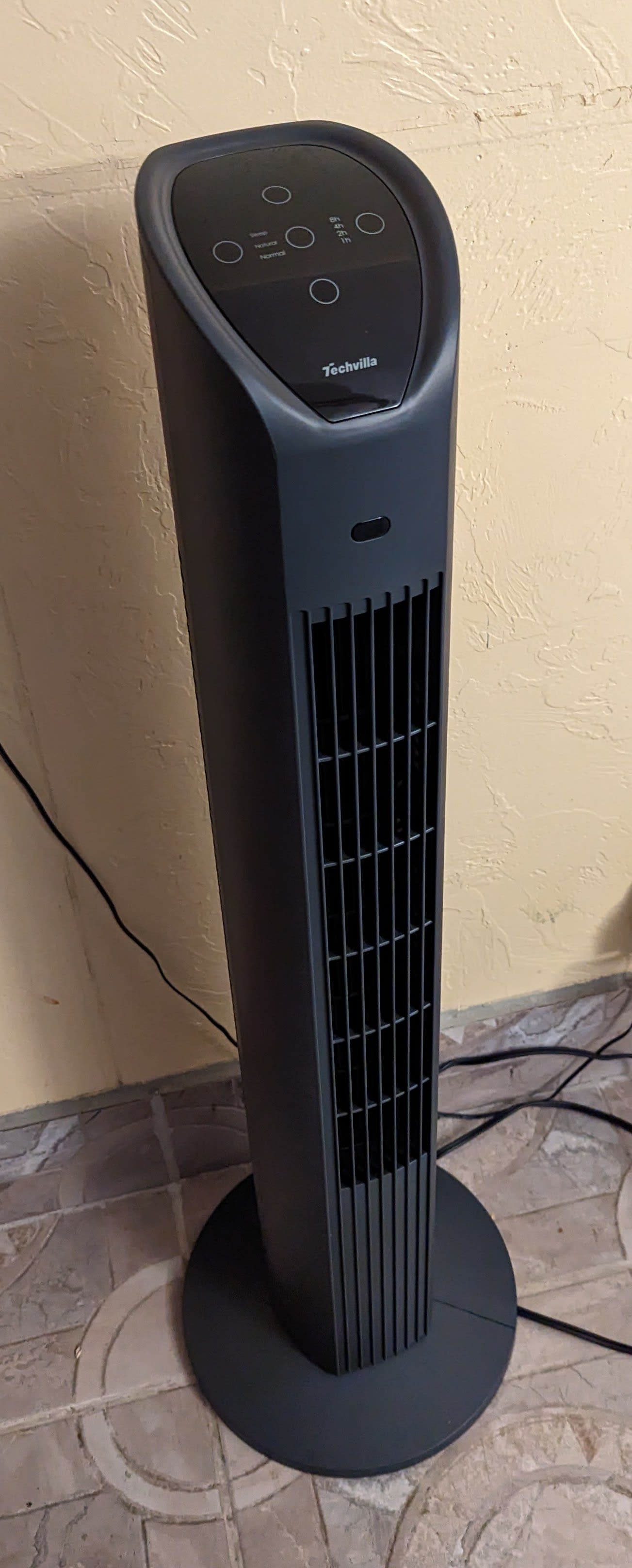 add text. And if you're using a screen reader, sorry, it's a picture of a tower fan and a mess of cables on a hideous tile floor that the previous owners put in and i have no desire to put money into replacing