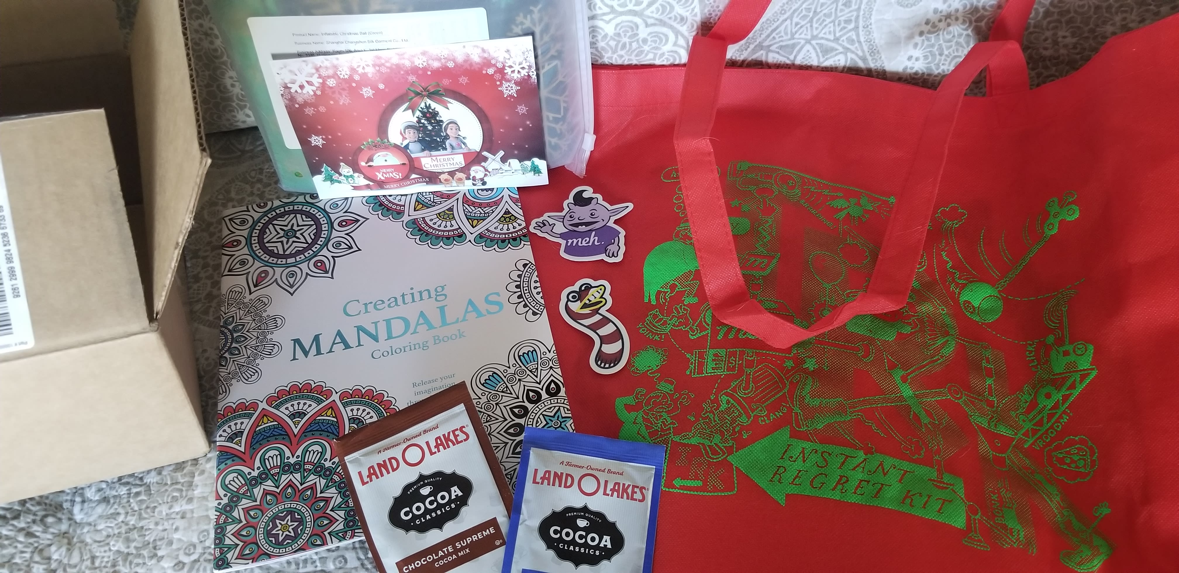 Second box just arrived. One red and green IRK bag, coloring book, Irk and Glen stickers, 2 pouches of cocoa mix and a 2 ft inflatable Christmas ornament ball. Thanks Meh! and Mehrry Christmas!