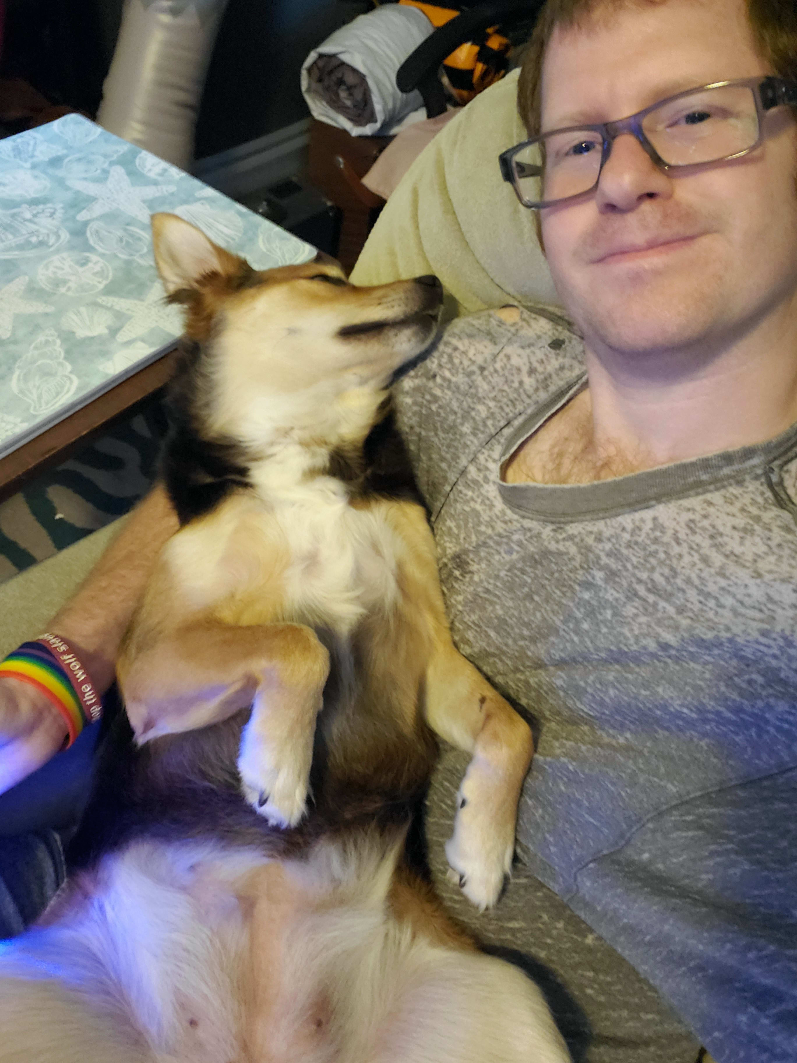 Me holding Lucy. Don't judge my work shirt!
