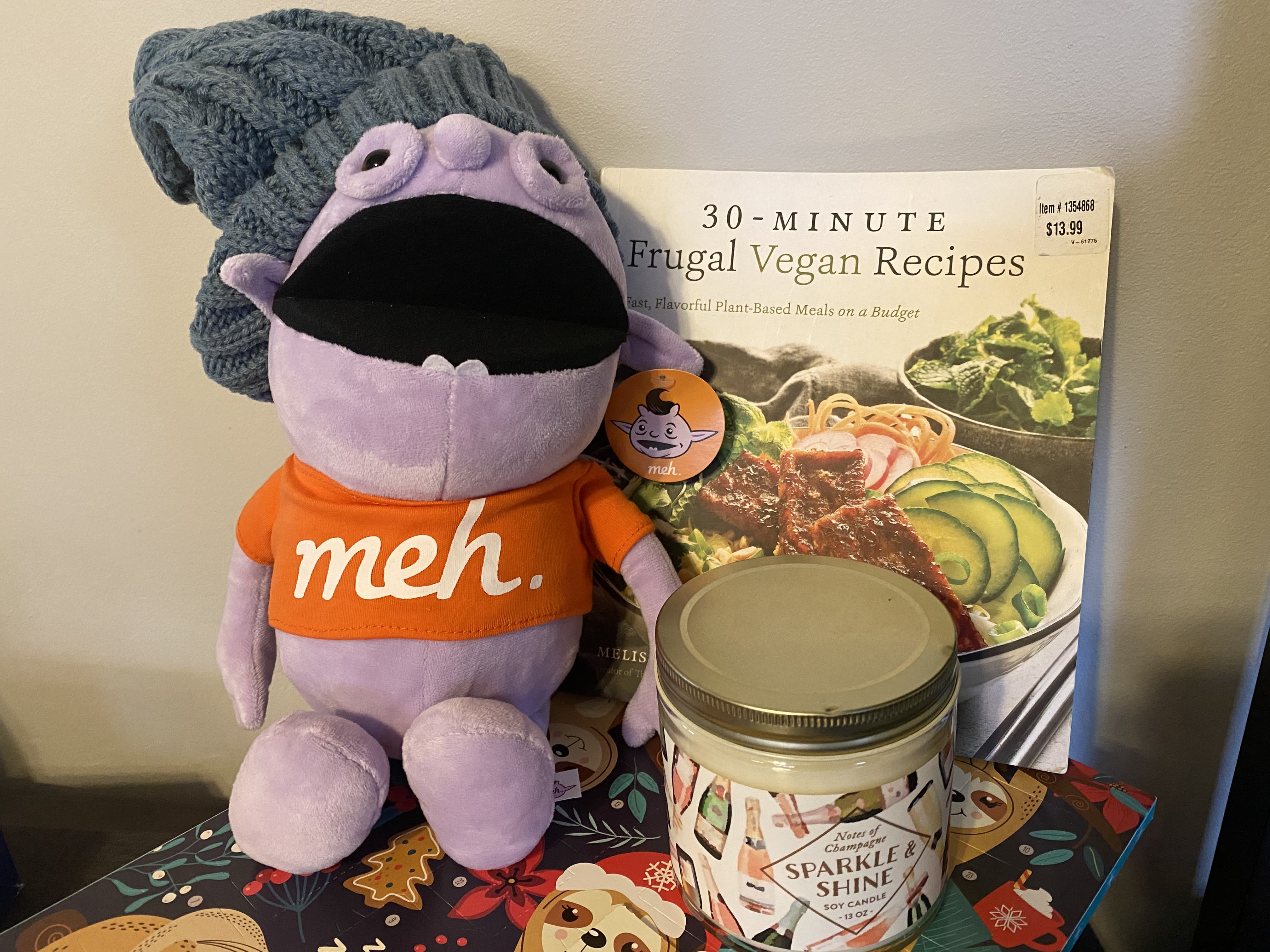 Irk, hat, candle, and a vegan cookbook with a recipe for yogurt parfait.