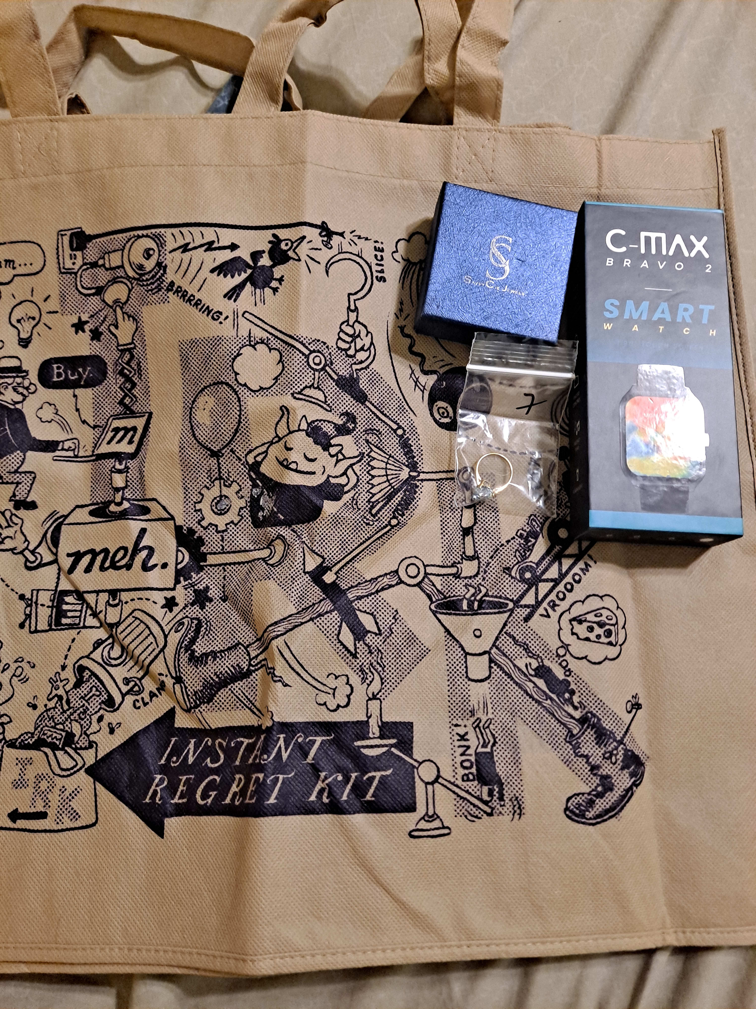 Ring, Smart Watch, and Tan IRK bag. 