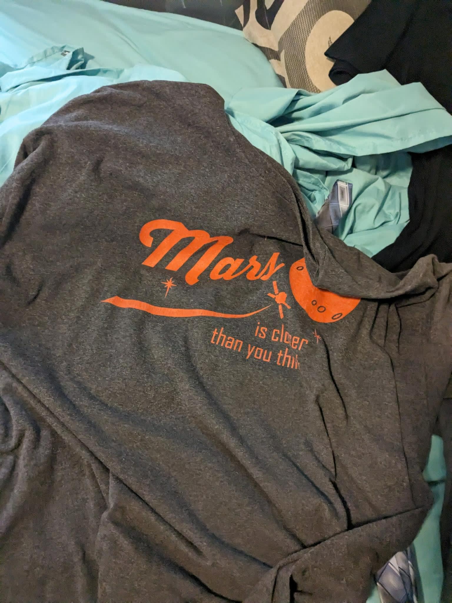 Mars shirt that reads Mars, it's closer than you think