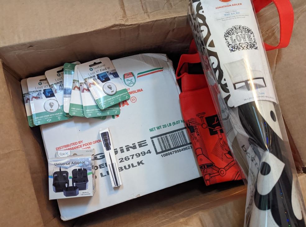 noods, wall art, adapter, makeup, trackers, bag