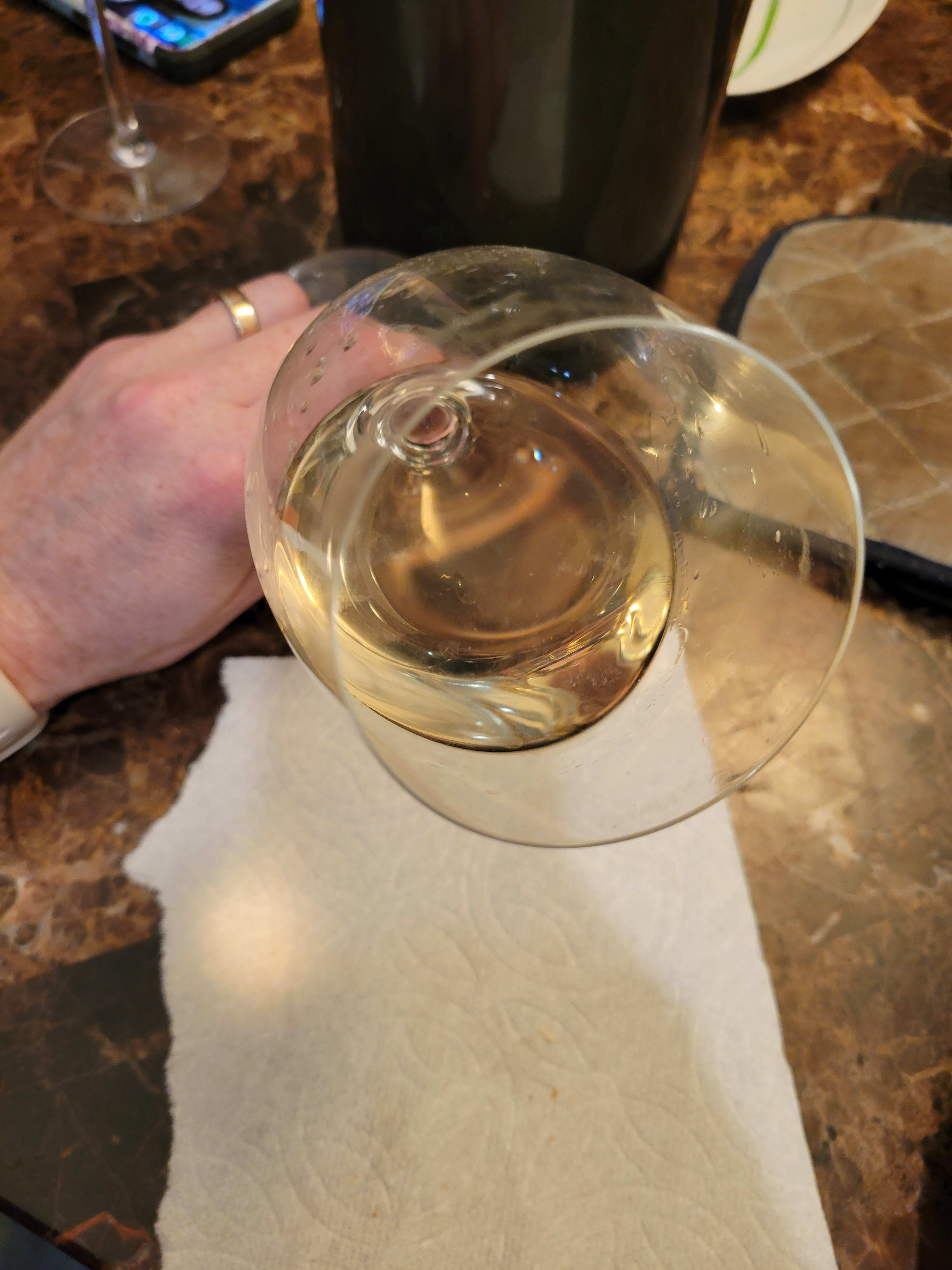 wine in tilted glass