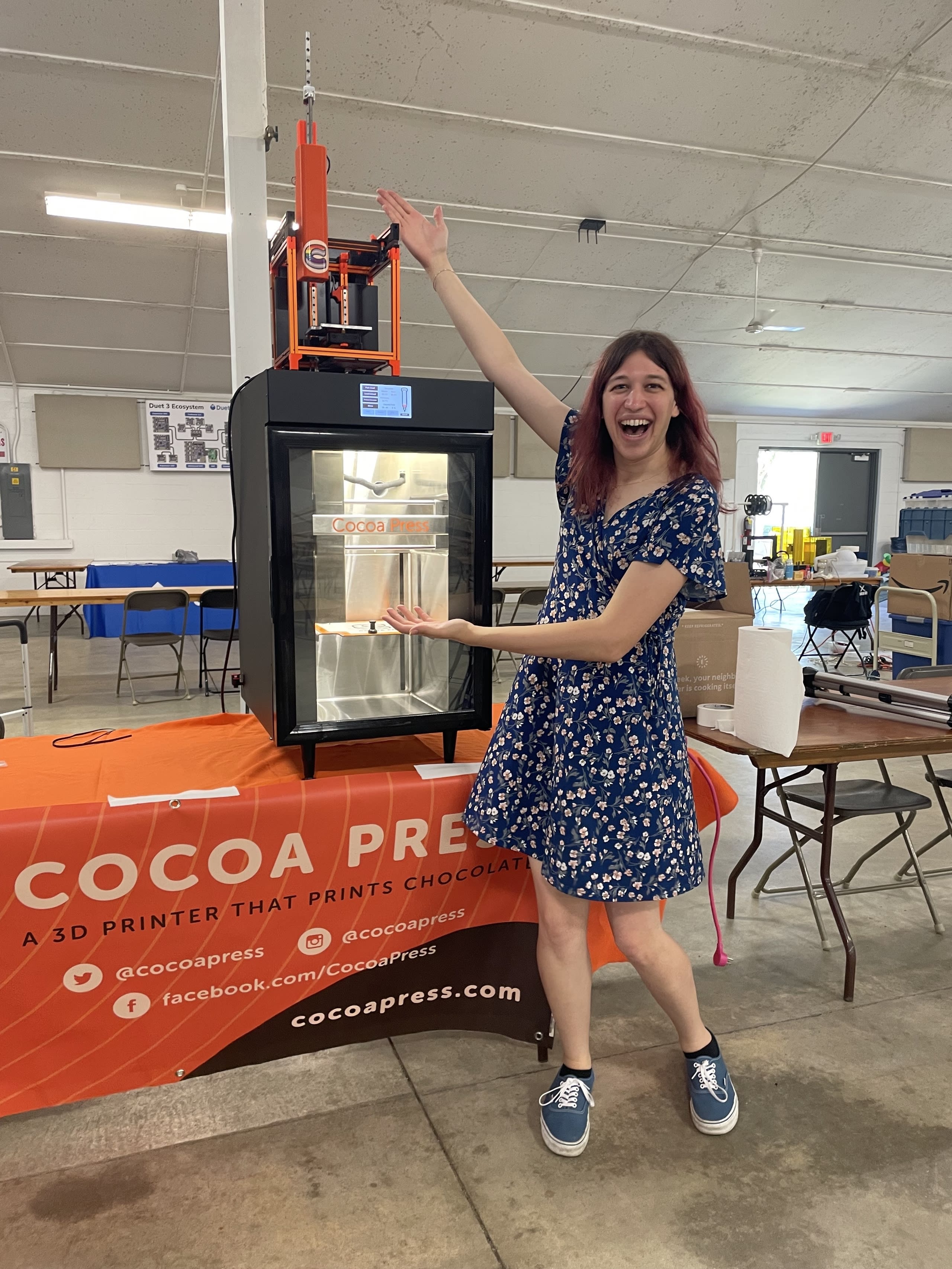 owner showing off the chocolate printer