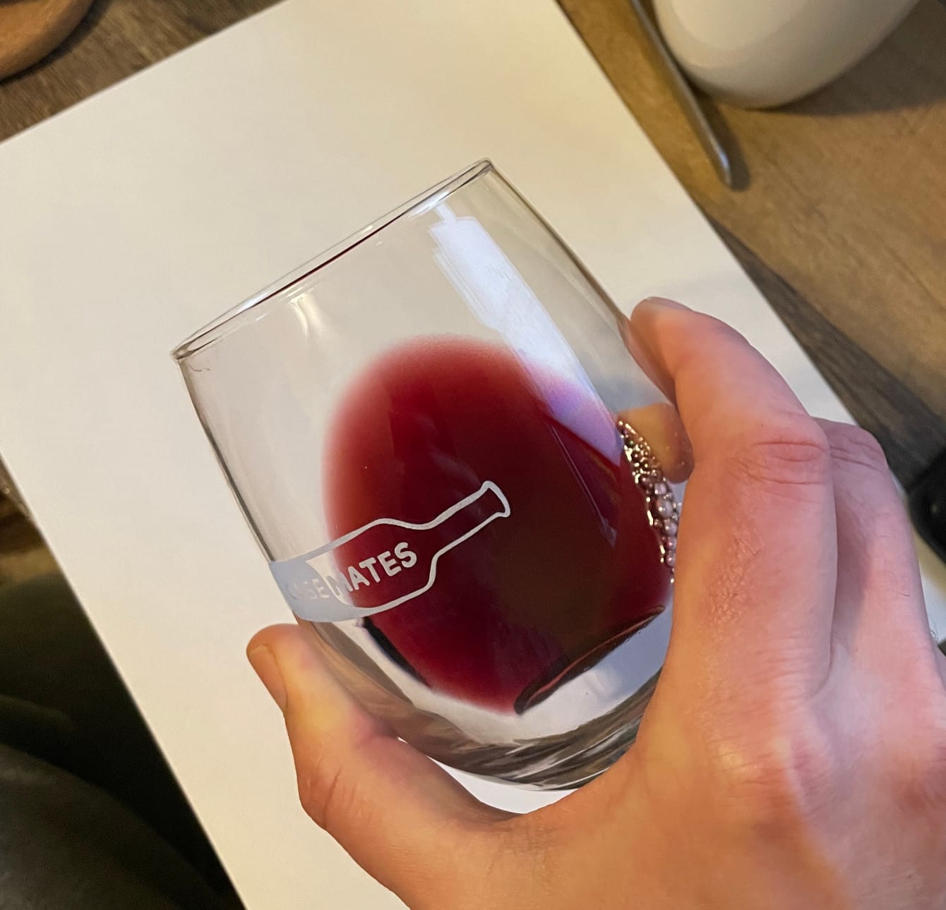 Wine in glass over white paper to better show the color