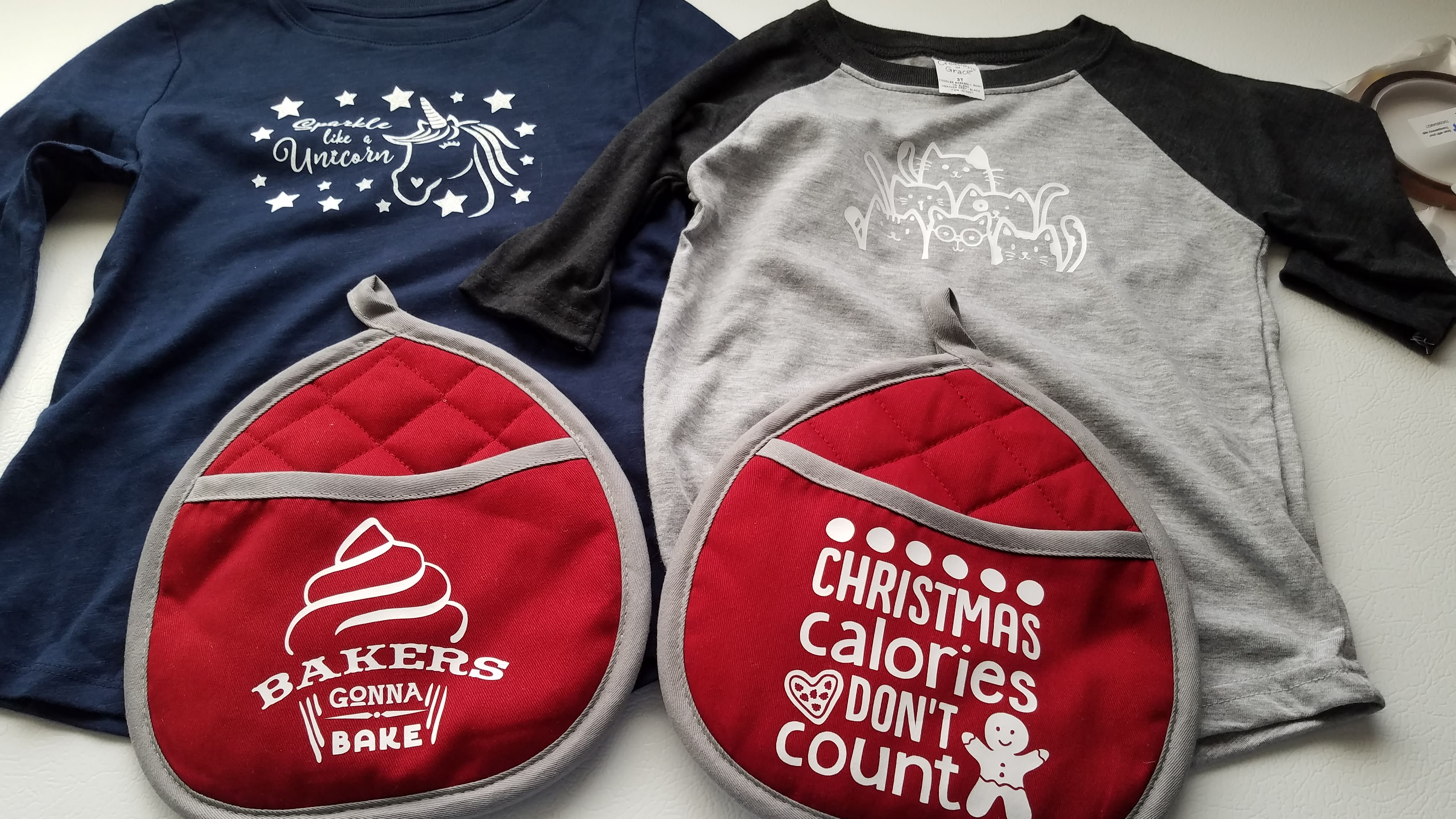 unicorn and cats shirts and pot mitts