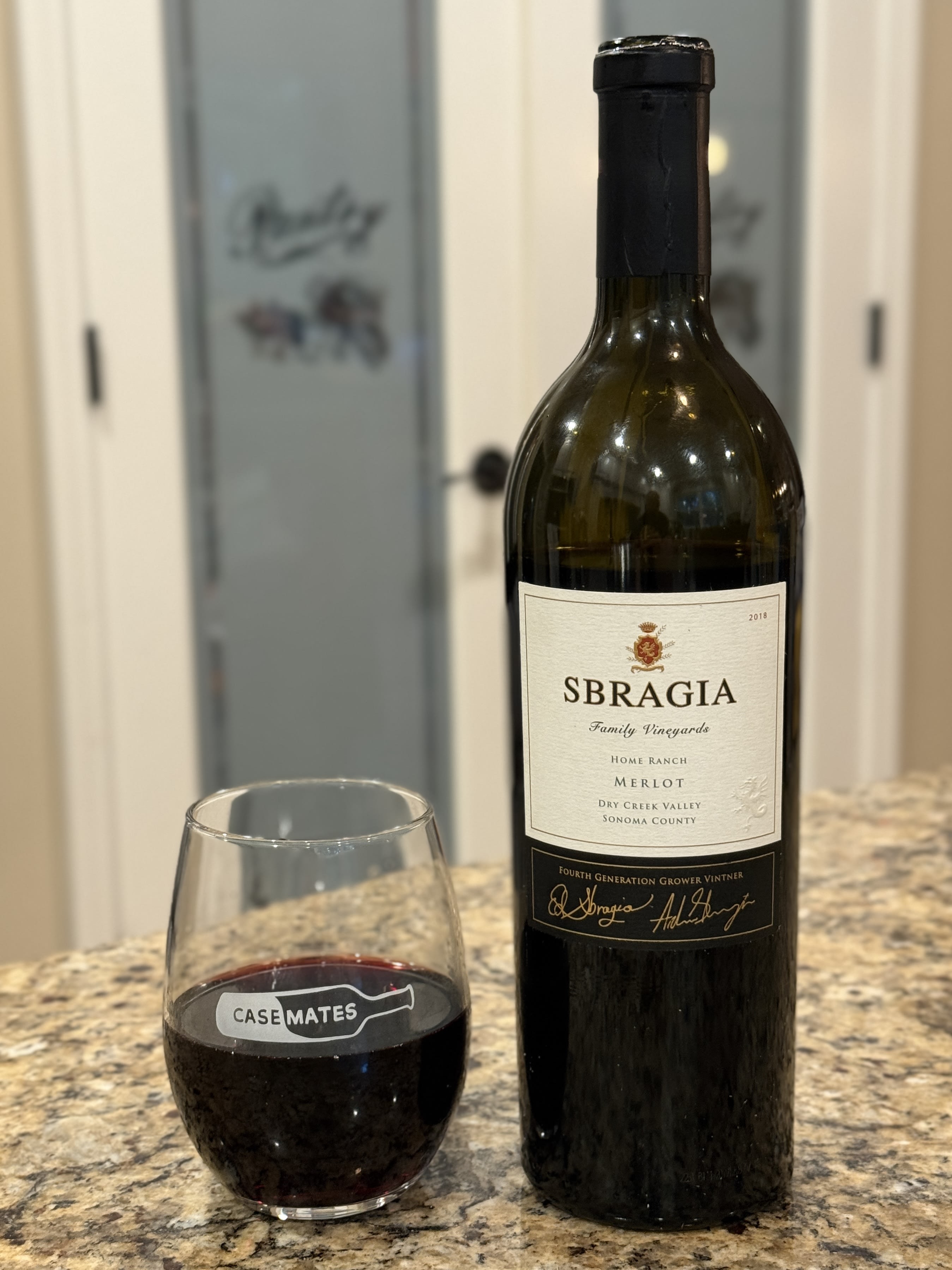 Bottle & Glass:
2018 Sbragia Family Merlot Home Ranch next to Casemates glass