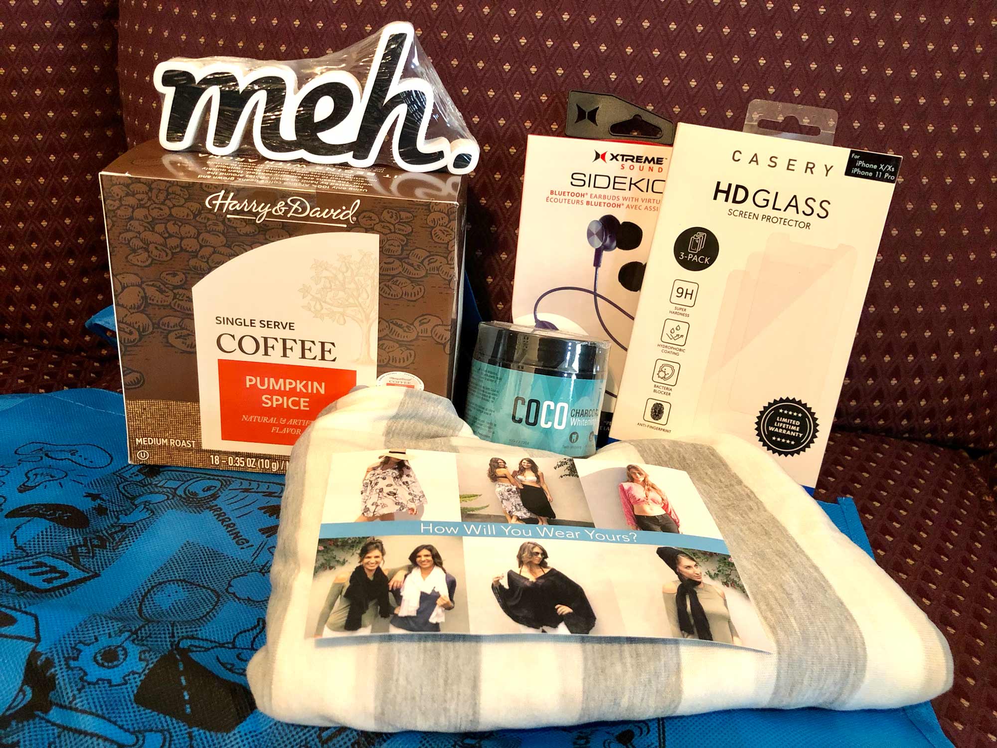 IRK Contents: Pumpkin spice cups, COCO charcoal teeth cleaning stuff, Some kind of Fabric Wrap with Holes but No Buttons that wants to know how you'll wear it, iPhone screen protectors, Sidekick bluetooth earbuds, Blue IRK bag #2