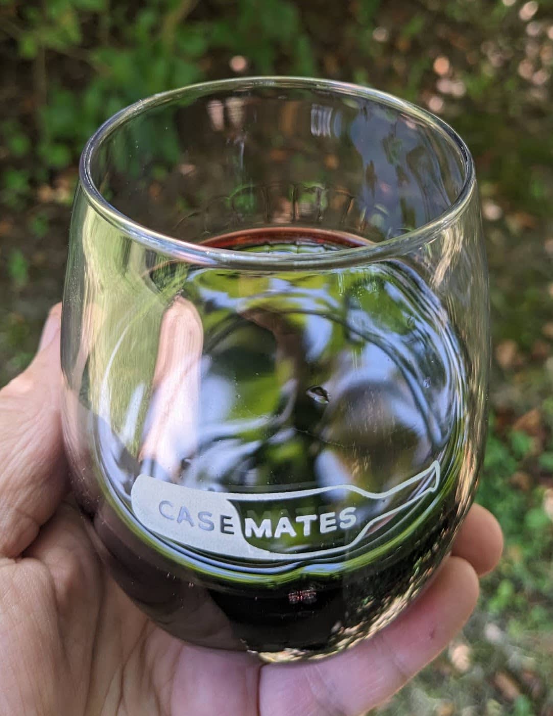 Wineglass showing legs of 2022 vintage Dharma red wine blend