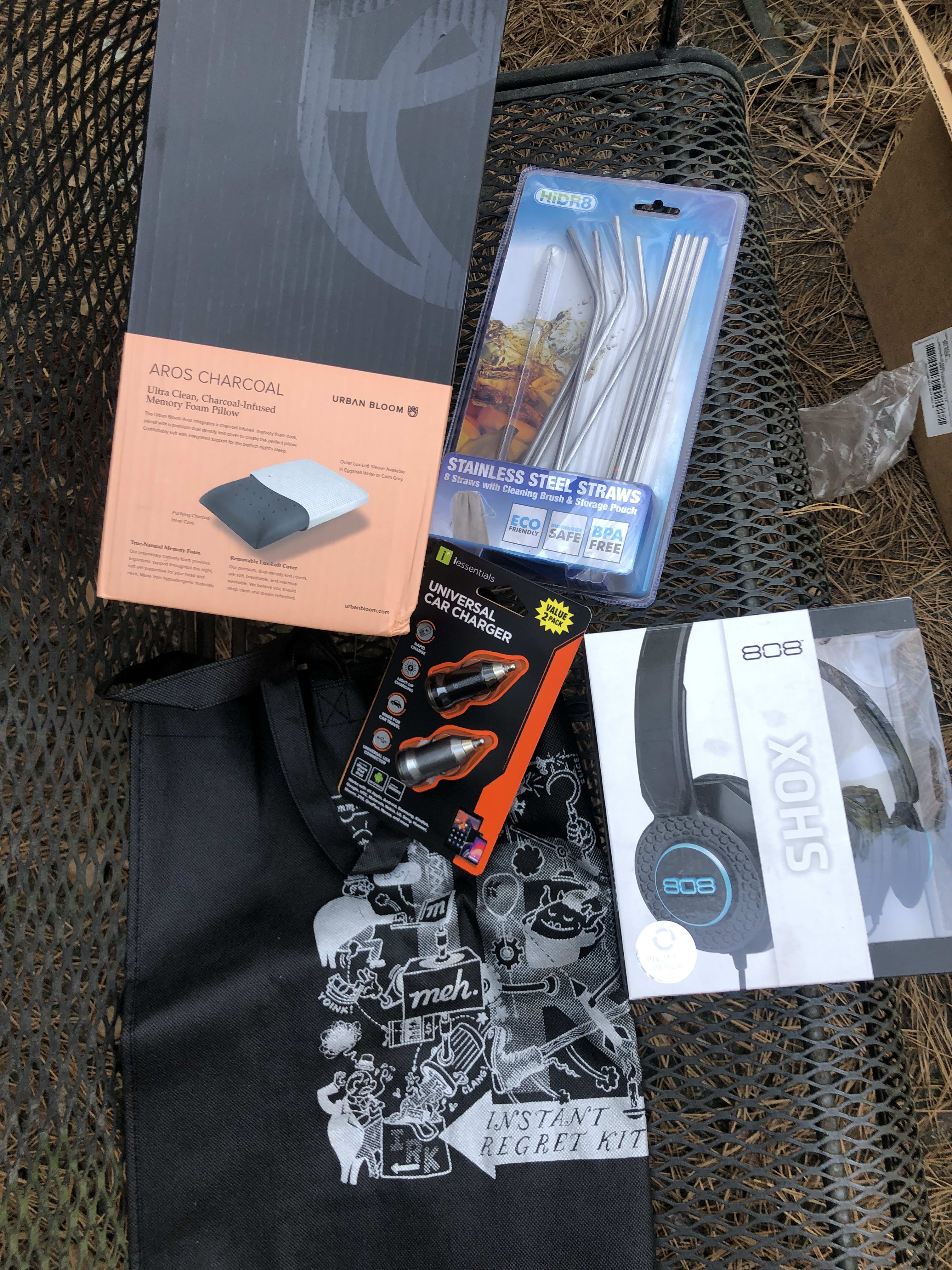 Straws, pillow, irk bag, wired headphones and phone chargers