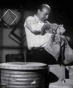 telly savalas with trash can