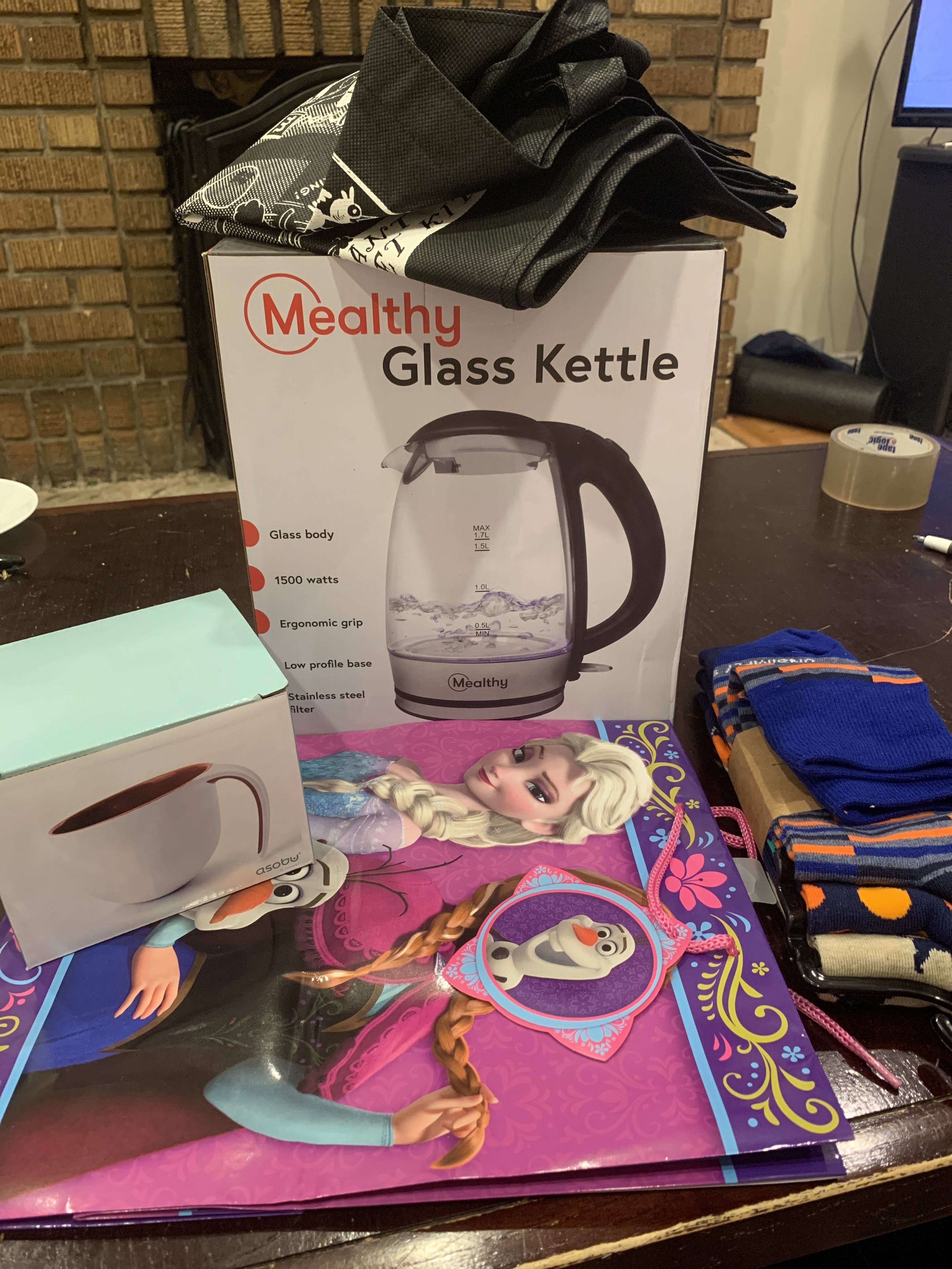 Kettle, socks, mug, and an empty frozen bag.