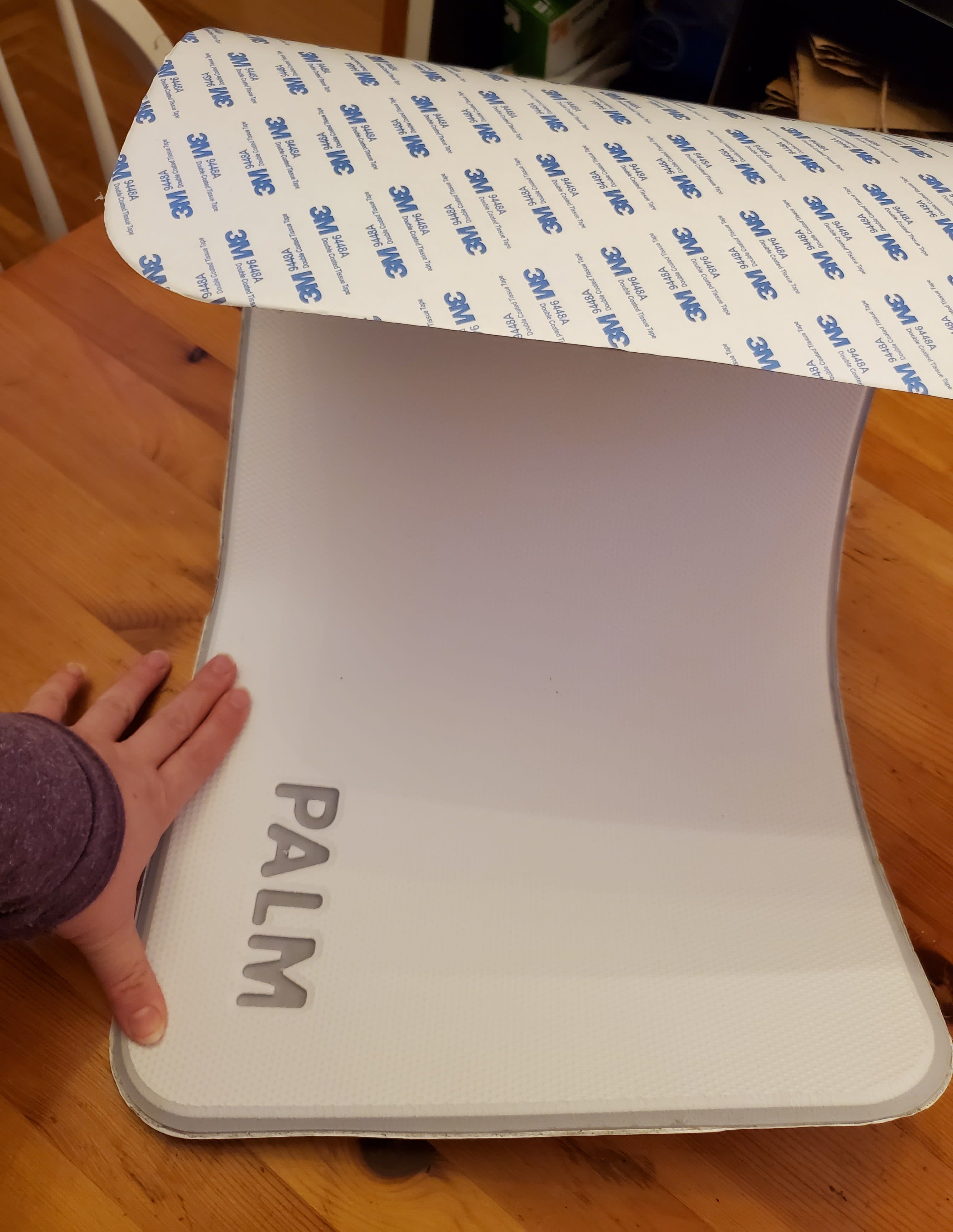 some unknown foam thing that says Palm on one side and has a 3M sticker back on the other