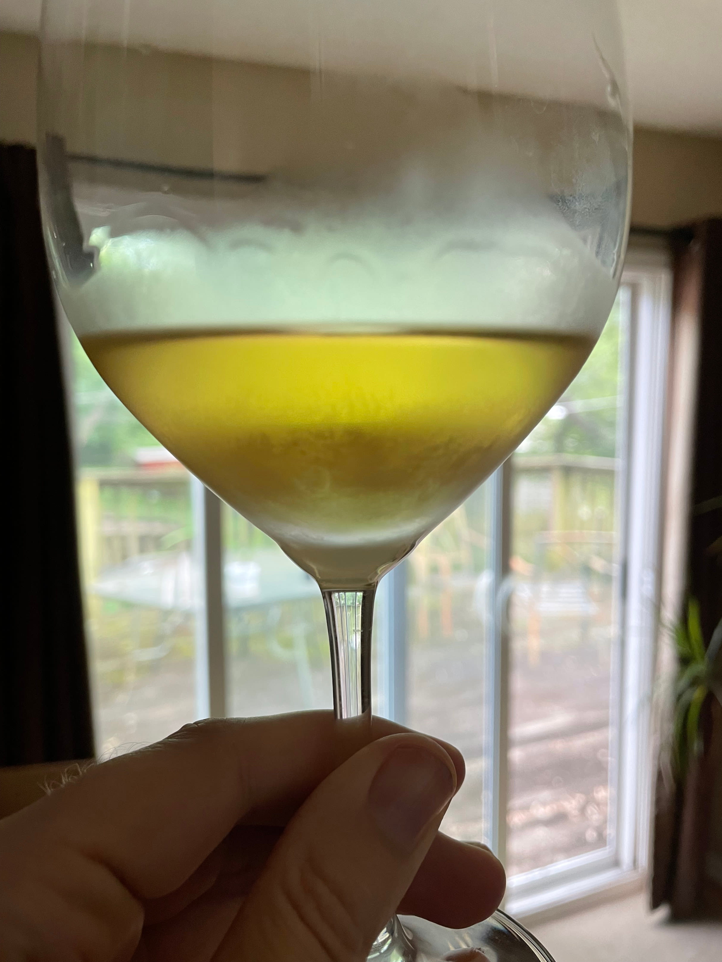 Wine in the glass, showing the golden color