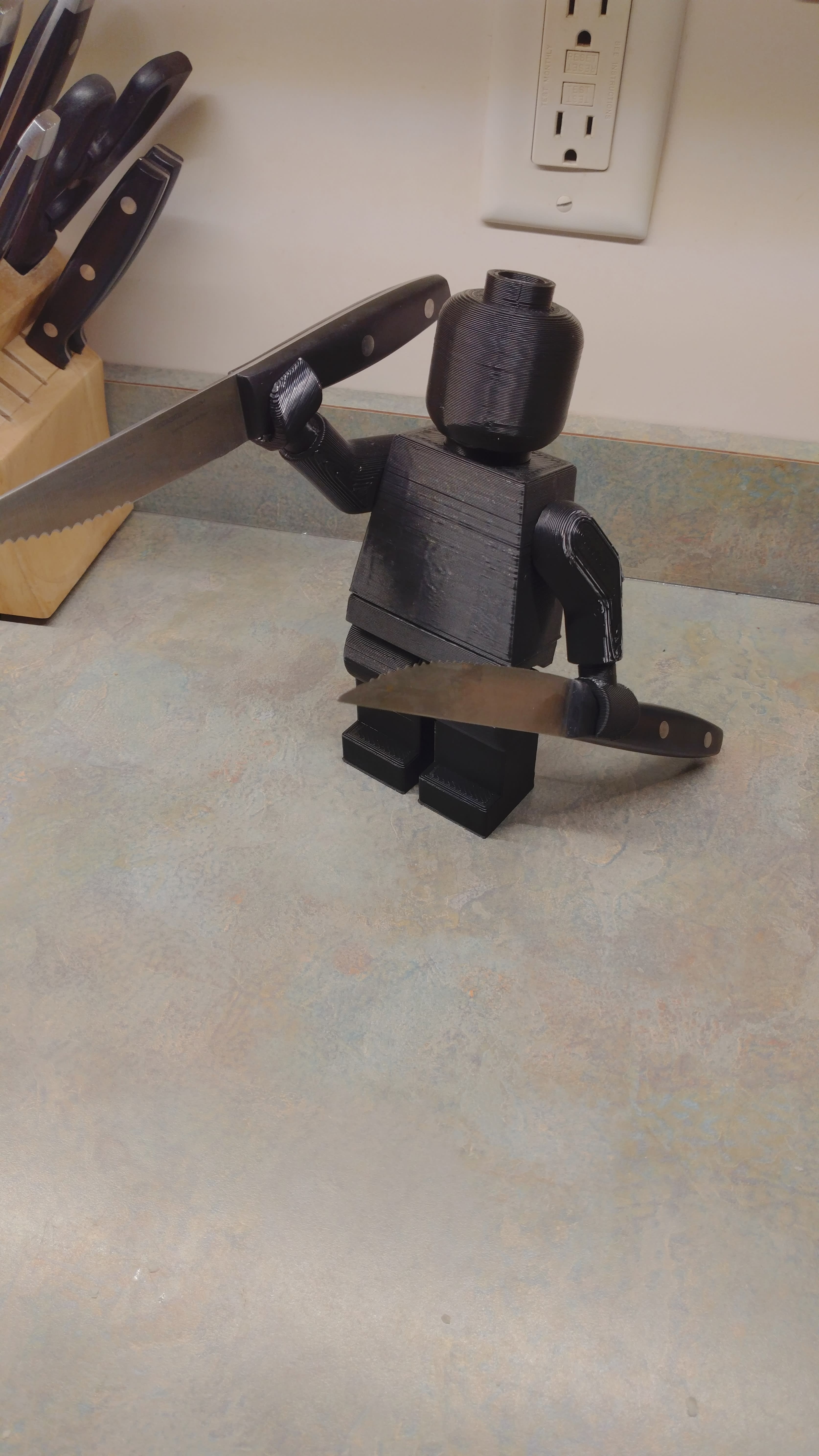 8" tall LEGO guy (steak knives for scale)