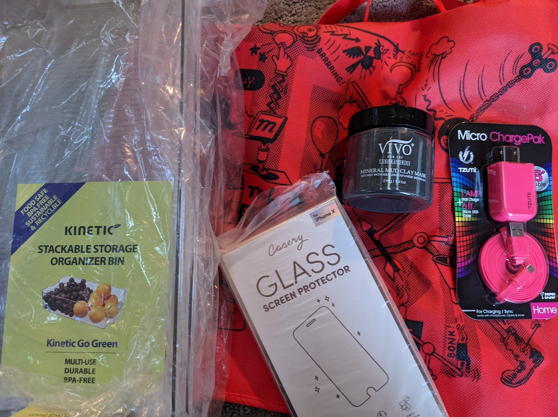 bins, phone charger, iphone x screen protector, mud mask, red irk bag