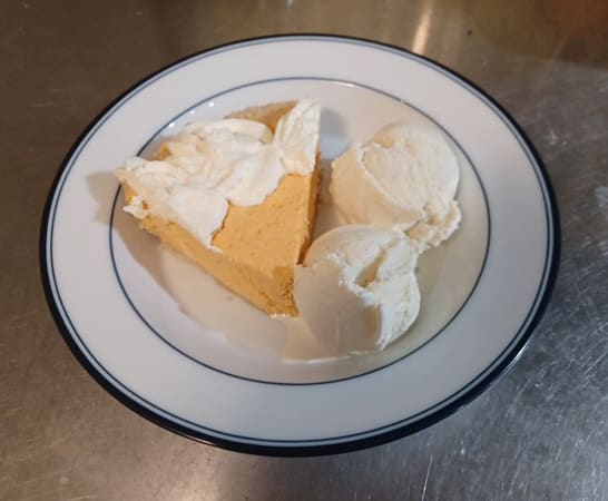 orange cream cake with vanilla ice cream