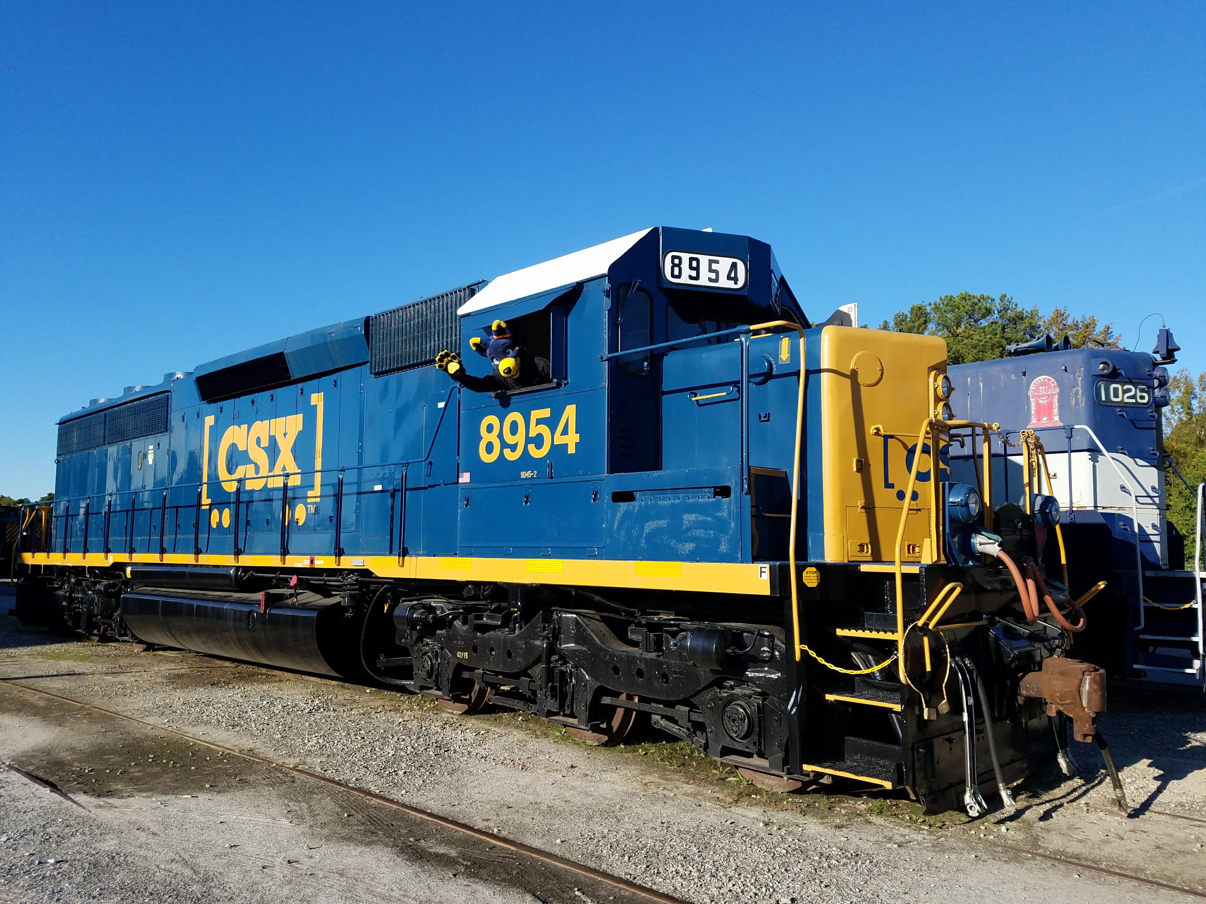 Mac waving from the cab of an EMD SD45-2 diesel locomotive