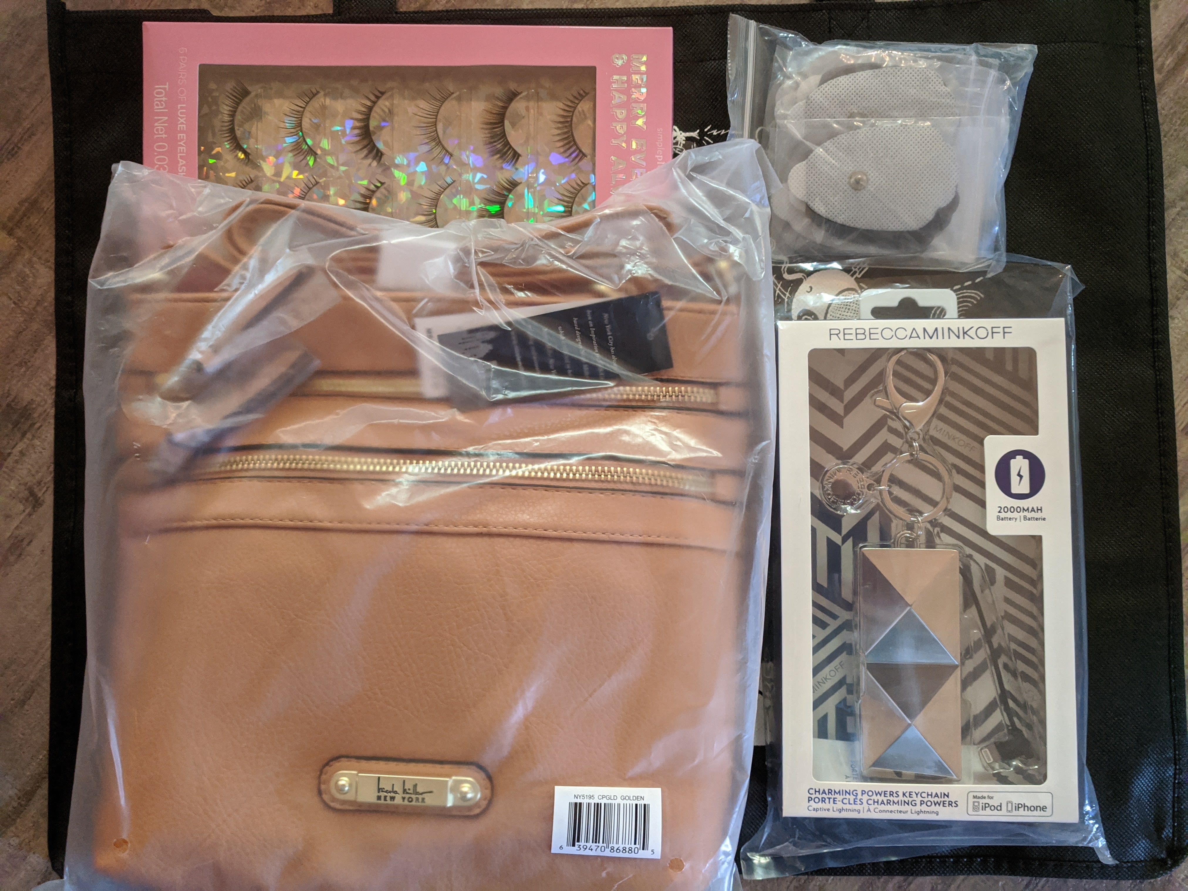 irk bag, handbag, keychain power bank, eyelashes, TENS pads