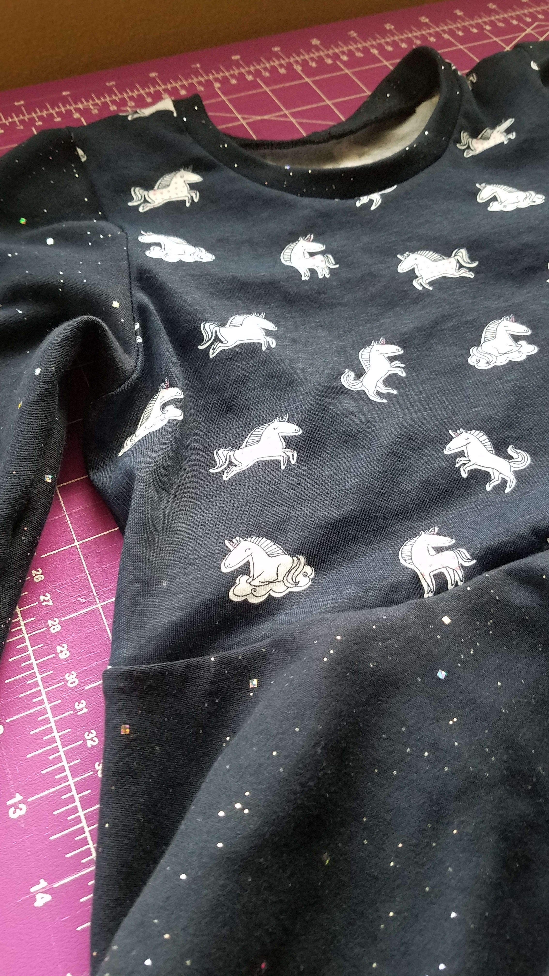 blue dress with unicorns and glitter