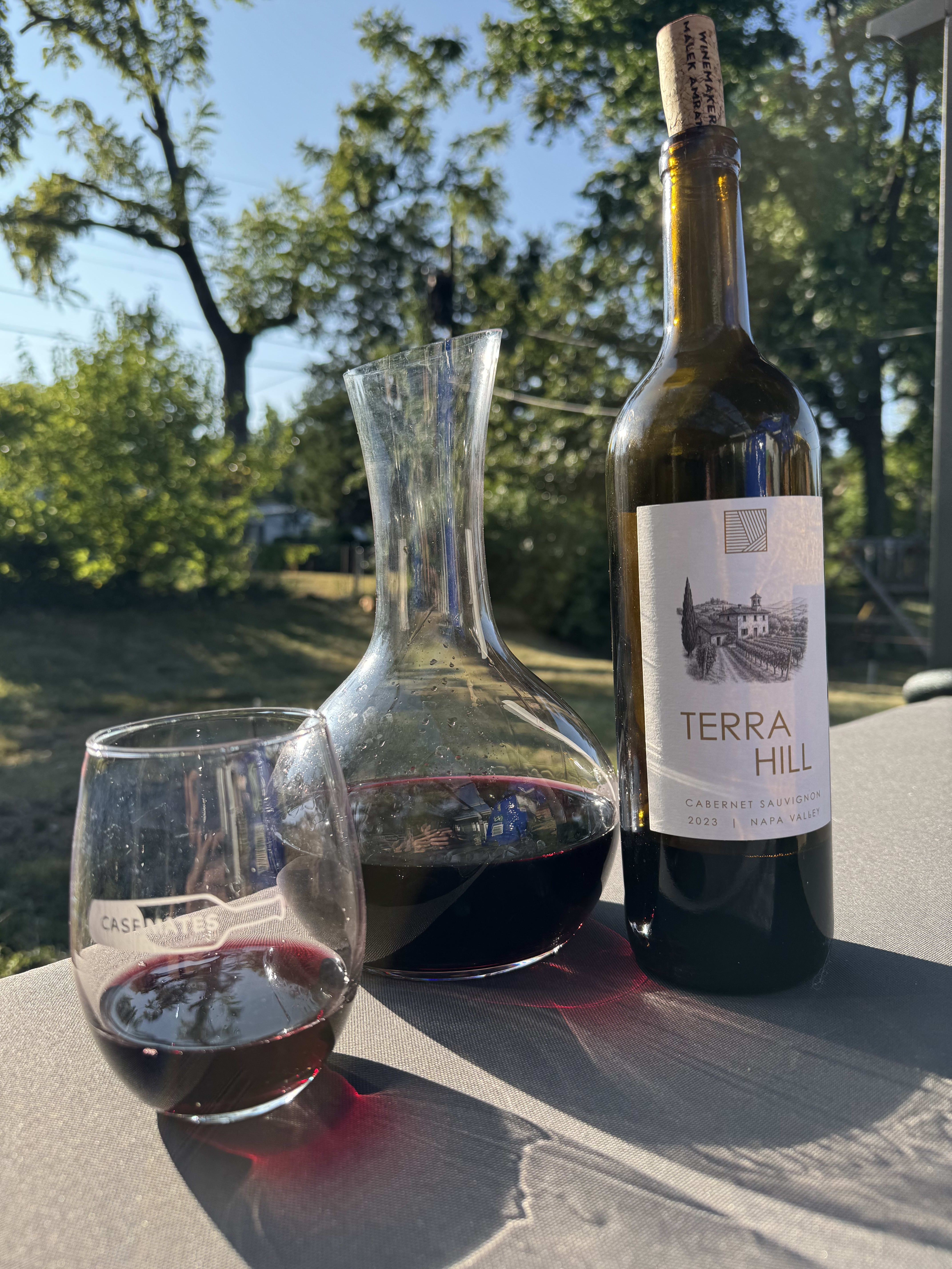 Terra Hill bottle, decanter and glass in sunny outdoors