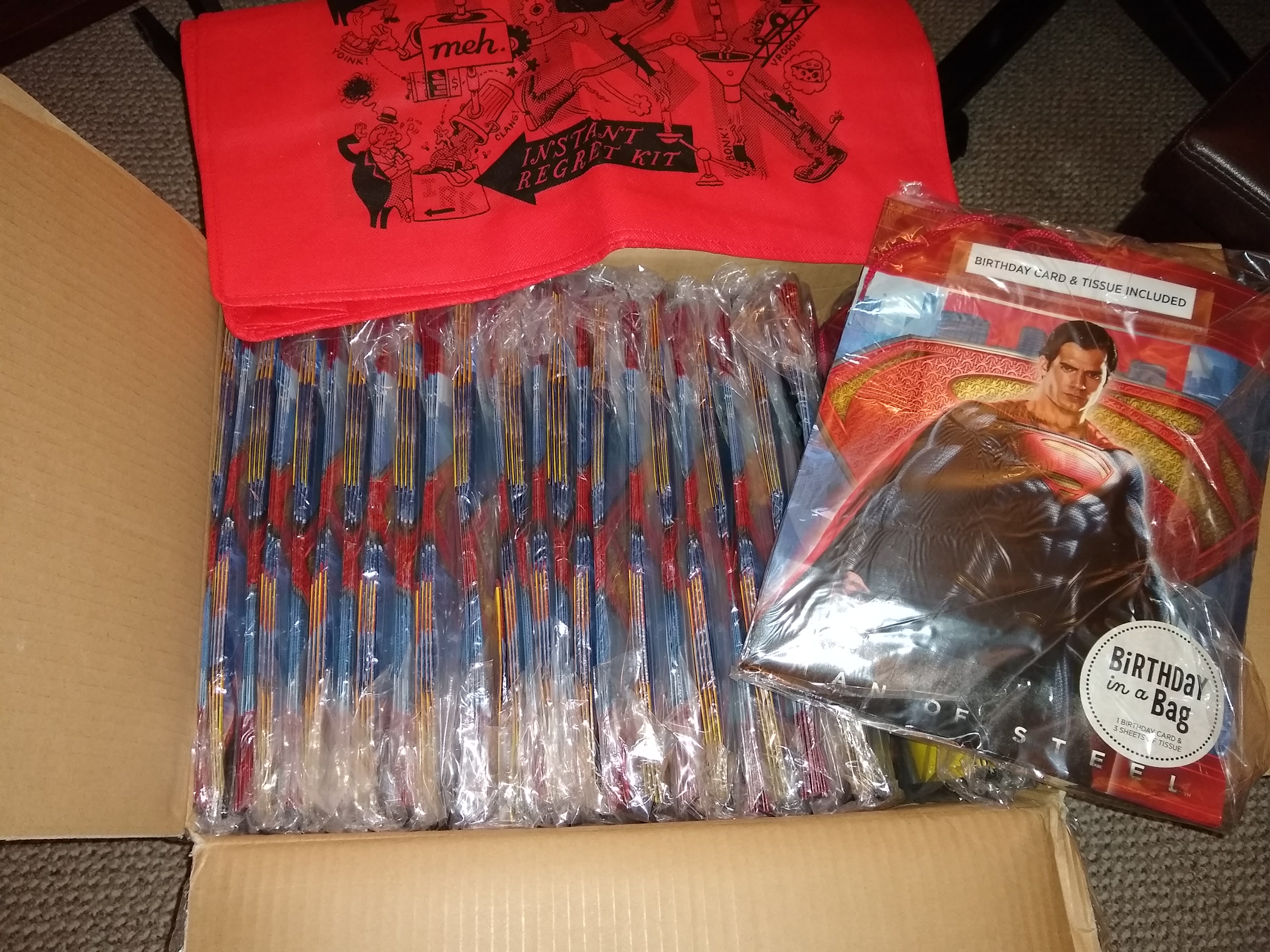 Another case of Superman bags here. Nothing else beyond an irk bag included. Regret has finally been achieved. It wasn't instant but it was pretty fast with FedEx. I guess I should see if the children's hospital is interested in them.