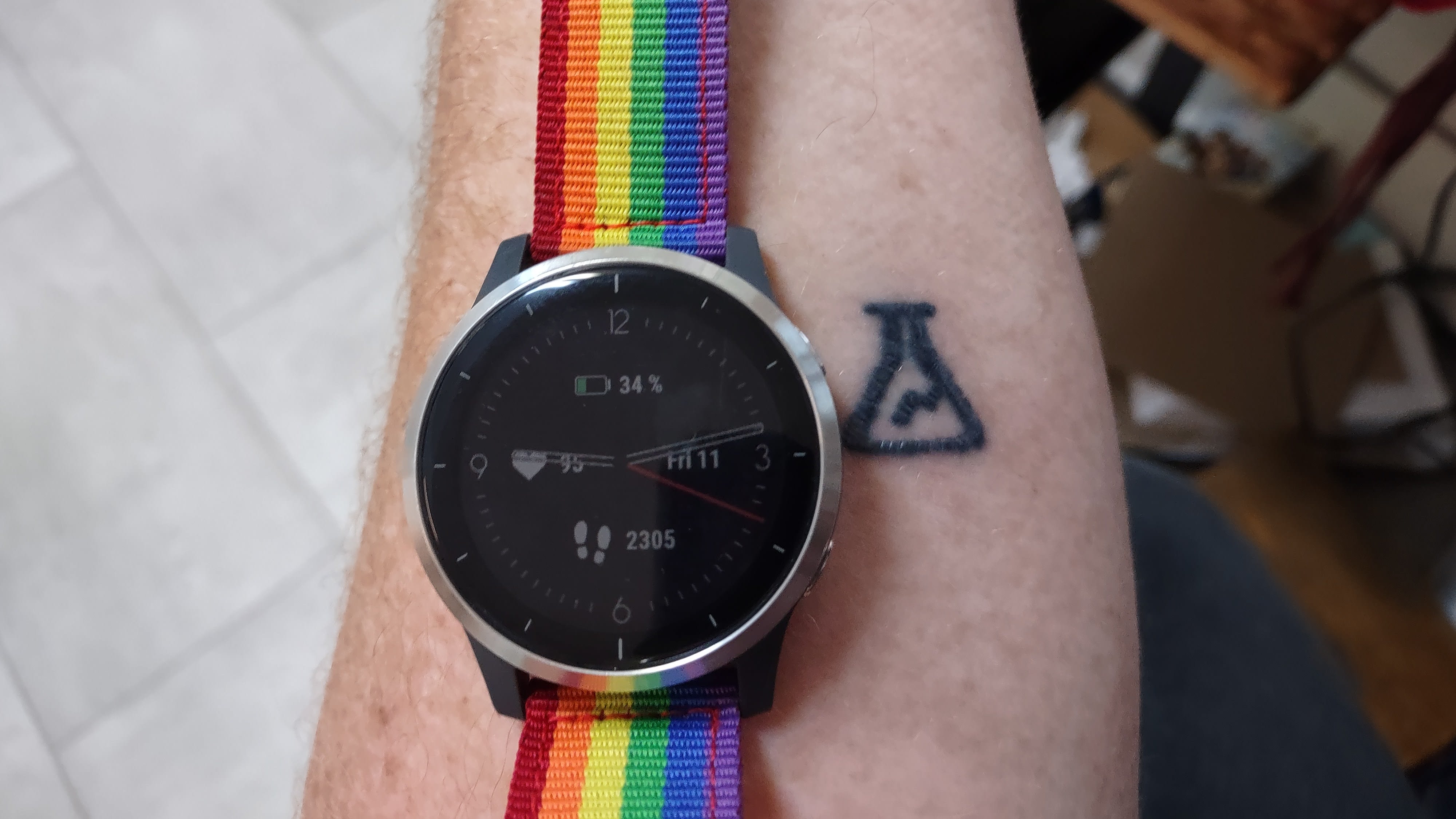 Rainbow watch band, flask tattoo.