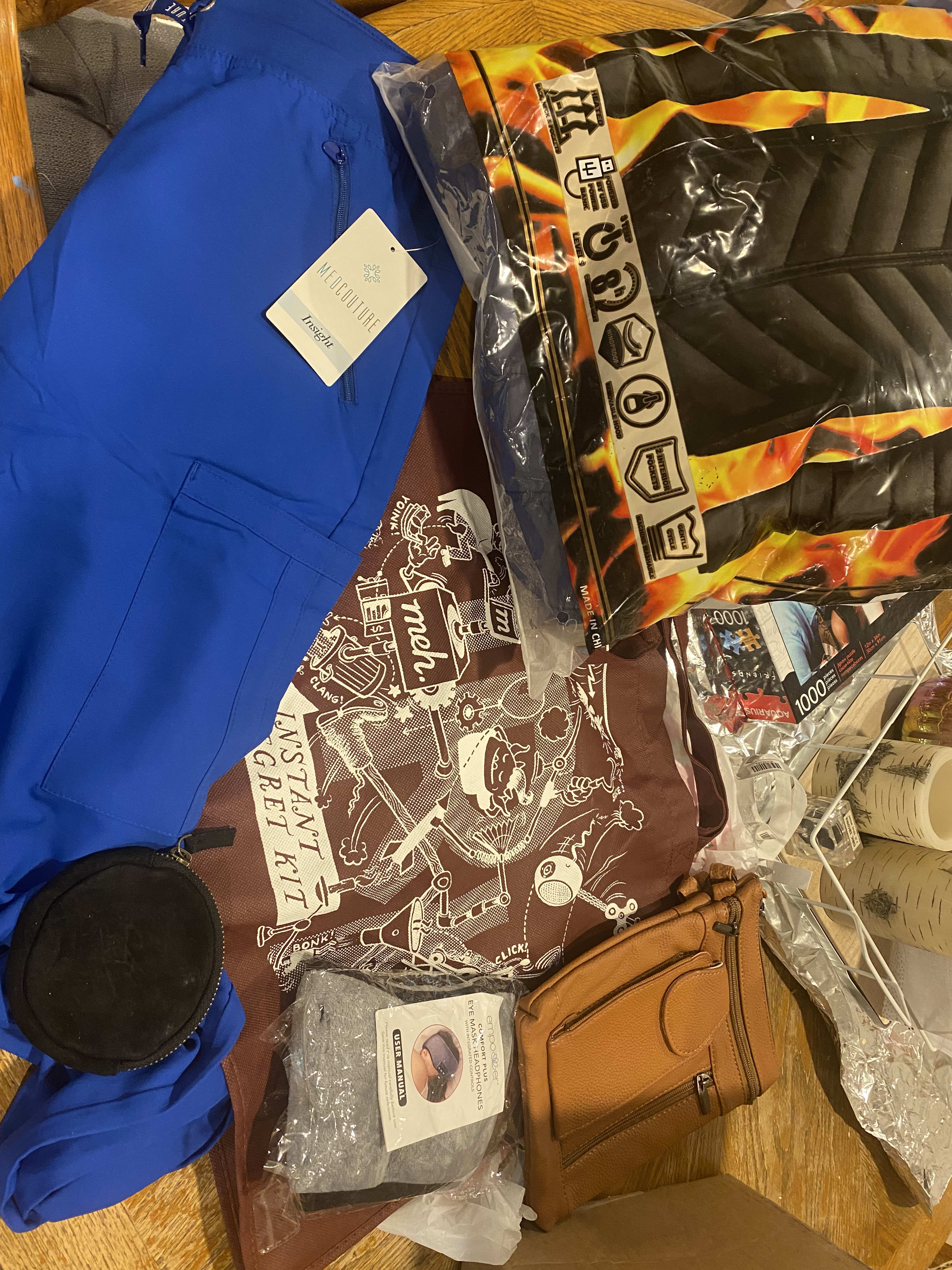 maroon irk bag, black puffer jacket, med couture leggings, change purse, leather purse, Bluetooth headphone eye mask