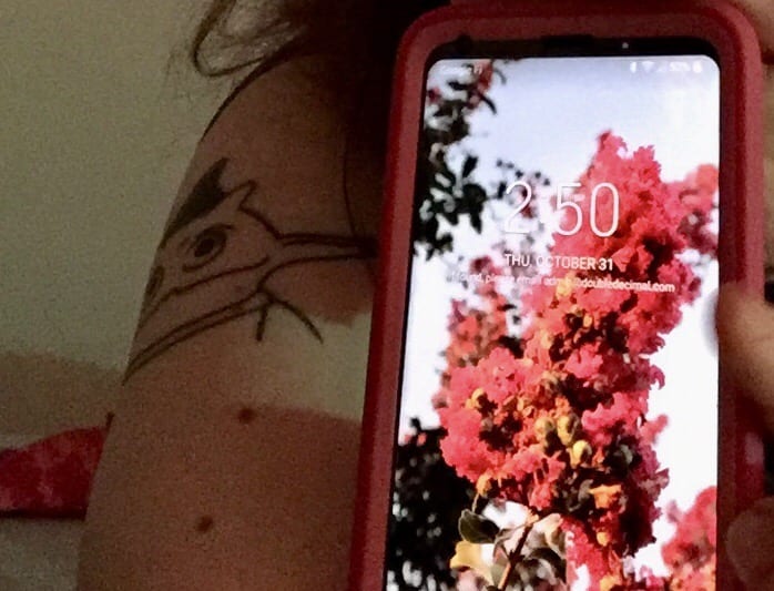 Picture of IRK tattoo and current date.