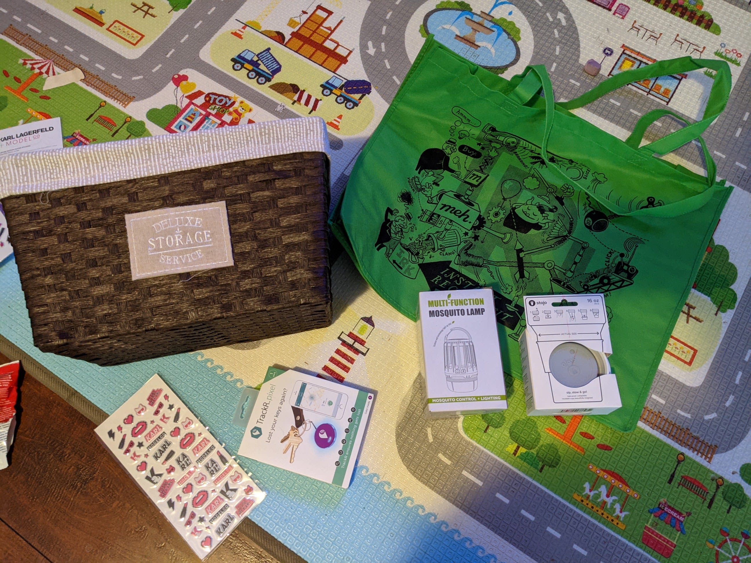 Mosquito LampCollapsible coffee cupTrackR PixelBox of Stickers(kid loved this)Decorative storage basketGreen IRK bag