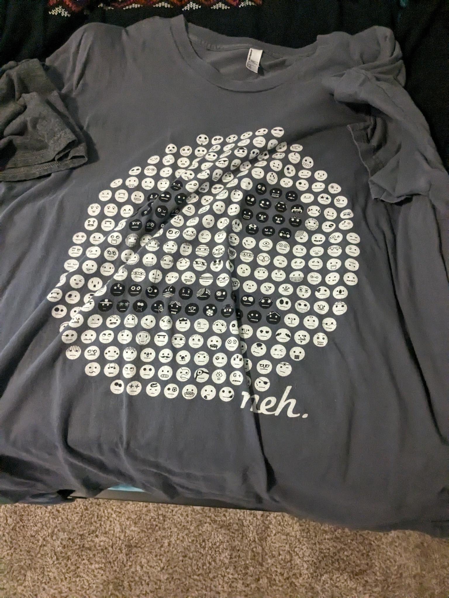 Pointilism shirt of Meh faces making a Meh face