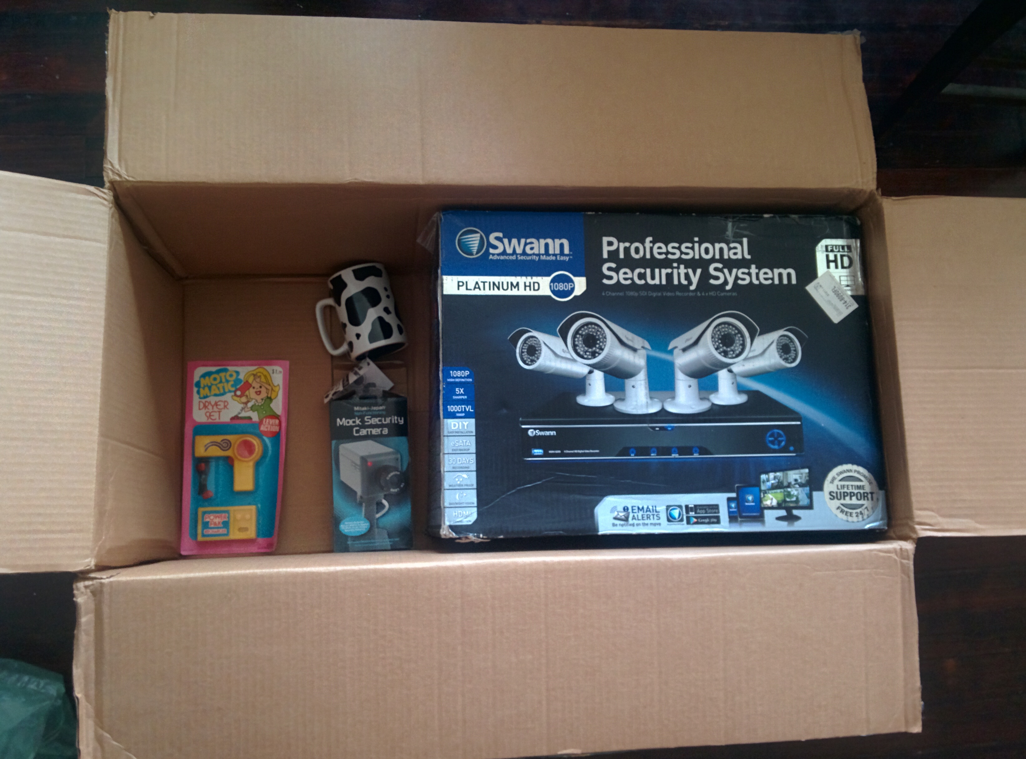 A Swann HD security system (what the hell am i gonna do with this??)A fake security camera (Is this some kind of running joke?)A 70s supermarket toy hair dryerA talking cow print coffee mug that says "Cow you doing today?" followed by a 'wah wah' bad joke sound effect. I wanted to throw it.A fuko bag.