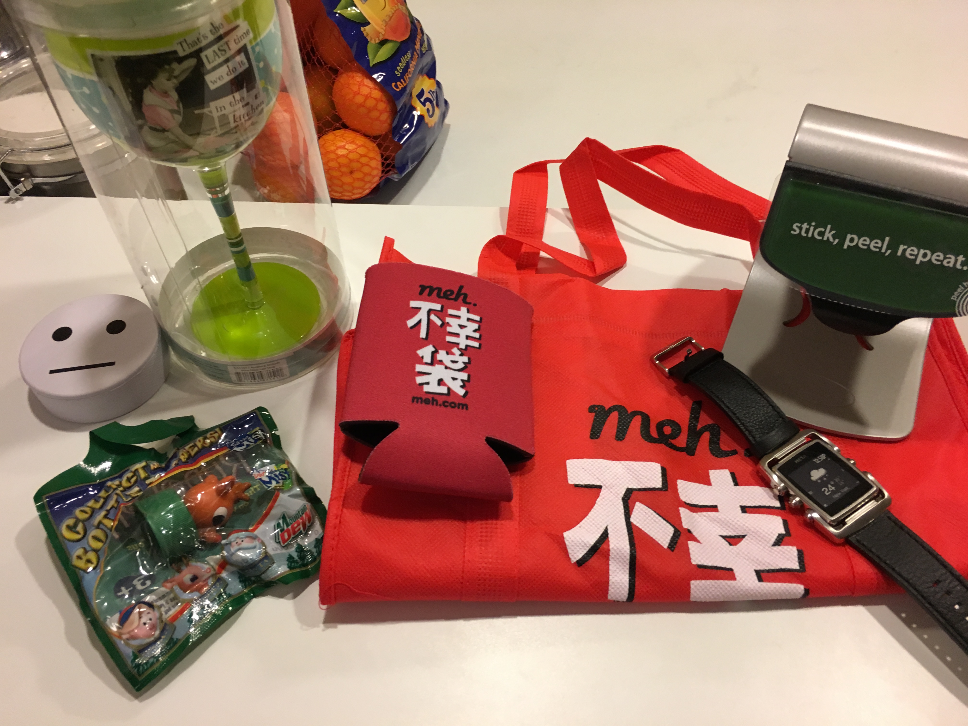 Standard Stuff...bag, koozie, puck, DOA watch sans charger, rudolf topper, fancy wino chalice (somehow in broken, and some sorta funky iPad stand