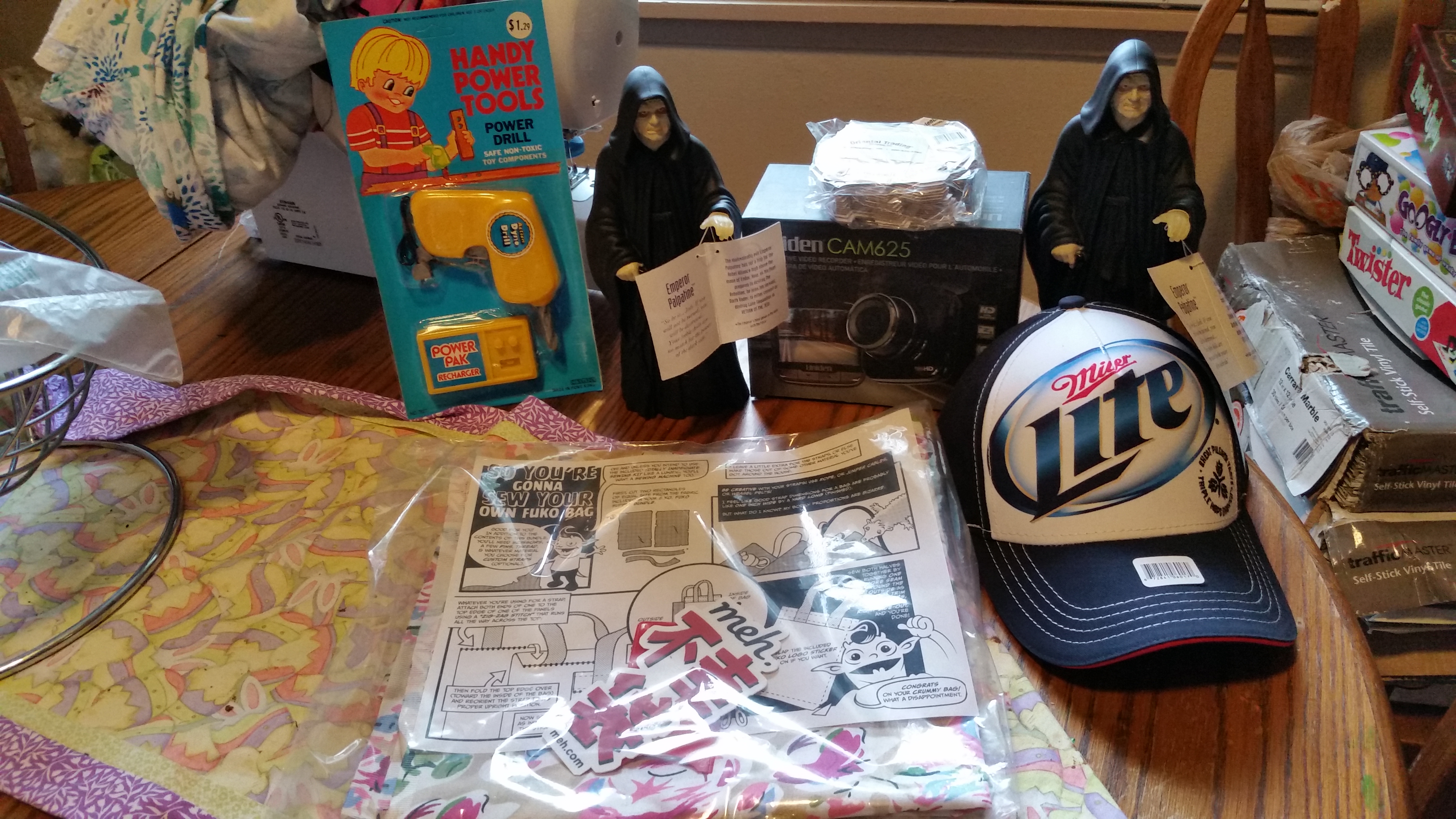 Two Emperor Palpatine figures (one isn't enough!)A Handy Power Tools Power Drill toyA nice Miller Light ballcapA package of Oriental Trading puzzle pieces (will use in my classroom :) )A DIY MF Fuko bag and....A working Uniden CAM625 dashcam missing the mount! :astonished: 