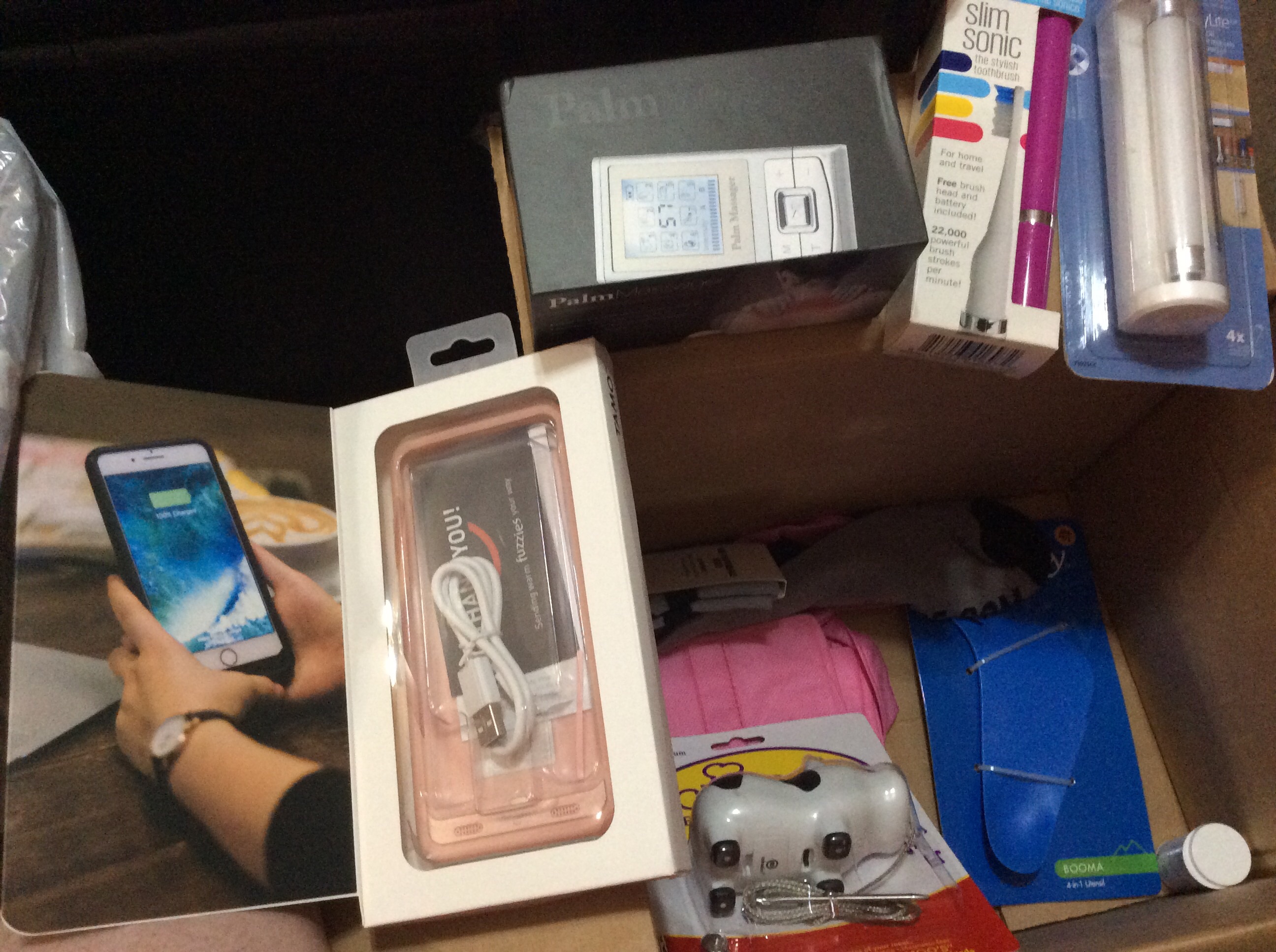 Portable TENS unit, iPhone 7 plus battery case, travel sonic toothbrush, utility light, spork thingy, meh socks, beef timer and pink fuko bag.  Nothing really great but not too bad either.  I can not complain.