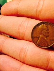penny in hand