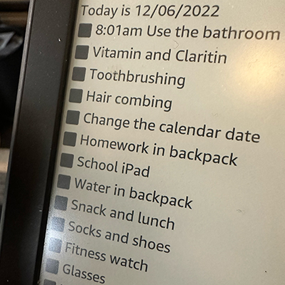 a Kindle showing a morning routine checklist